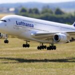 Lufthansa airplane on runway at Munich airport with cloudy sky
