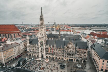 Apprentices leap into the Fischbrunnen fountain at Munich’s Marienplatz during the Metzgersprung tradition