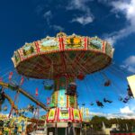Families with children riding attractions at Oktoberfest in Munich on family day