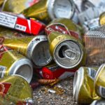 Street near Oktoberfest grounds in Munich with bottles and trash on sidewalk