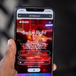 Smartphone showing Tinder app next to euro banknotes symbolizing romance scam