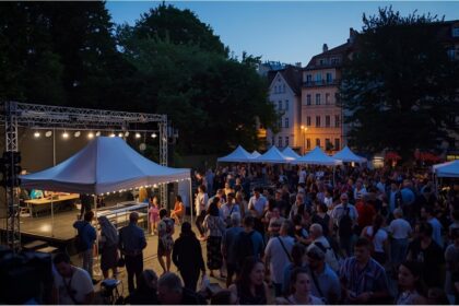 Visitors enjoying the Berg am Laim Neighbourhood Week festival in Munich.