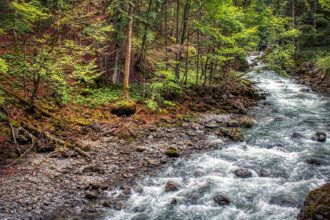 Hikers on a trail through the Breitachklamm gorge in Bavaria