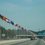 Highway with EU flags symbolizing new cross-border traffic rules