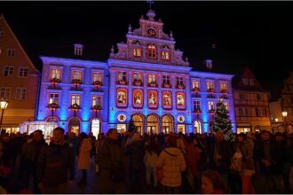 Illuminated town hall in Gengenbach with Advent calendar windows during Christmas season