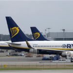 Parked airplanes at a German airport as airlines cut routes and reduce capacity