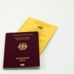 German passport and fake language certificates symbolizing citizenship fraud