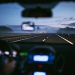Car driving on a German autobahn at sunrise representing 2026 mobility changes