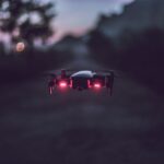 Drone flying at night over industrial facility in Germany