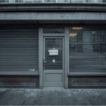 Storefront with insolvency sign as business closures rise in Germany