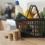 Shopping basket and euro coins symbolizing rising cost of living in Germany