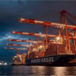 Kühne+Nagel shipping containers at a port during slowdown caused by U.S. trade tensions