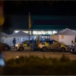 Police vehicles outside a supermarket in Lemgo after a fatal knife attack