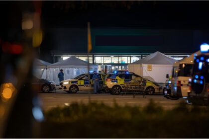 Police vehicles outside a supermarket in Lemgo after a fatal knife attack