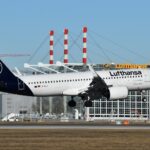 Night view of Munich Airport terminal with empty runway