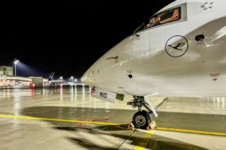 Munich Airport terminal at night after drone disruptions with stranded passengers