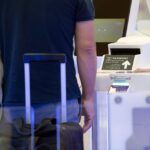 Passengers at Munich Airport security checkpoint with new CT scanners