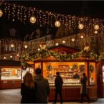 Visitors enjoy Munich’s Marienplatz Christmas market with festive lights and wooden stalls