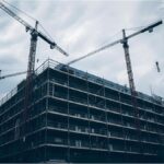 School under renovation with construction cranes in Munich’s Neuhausen district