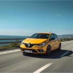 Rear swing doors of a van showing exposed latch area