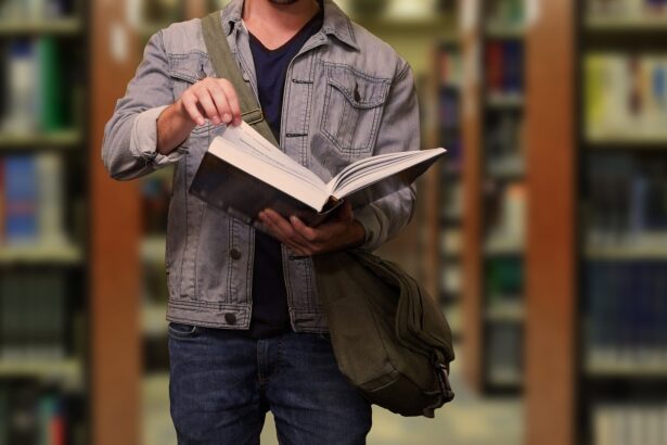Student with a book at the library of LMU university at Munich