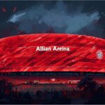Allianz Arena glowing in red at night during a football event in Munich