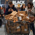 Amazon boxes and Black Friday signs in a shopping mall during sales week 2025