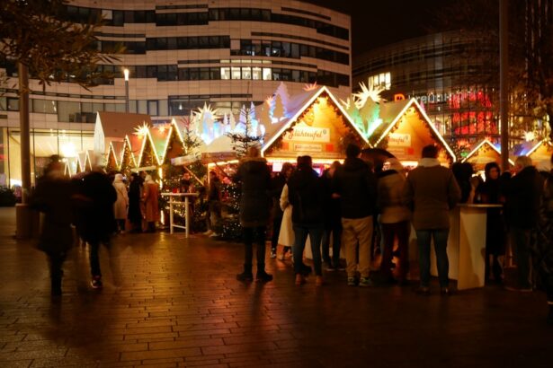A mulled wine stand at a German Christmas market with warm lights and visitors ordering drinks.