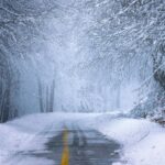 Frost-covered road in Germany during an early winter cold snap with DWD warnings.